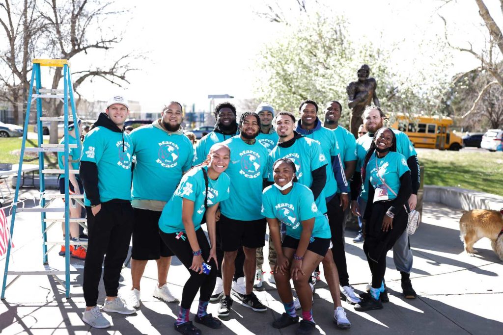 A smiling group of March for Peace participants