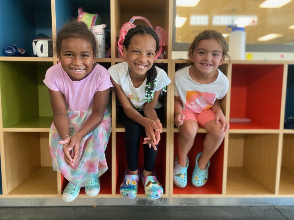 three smiling girls