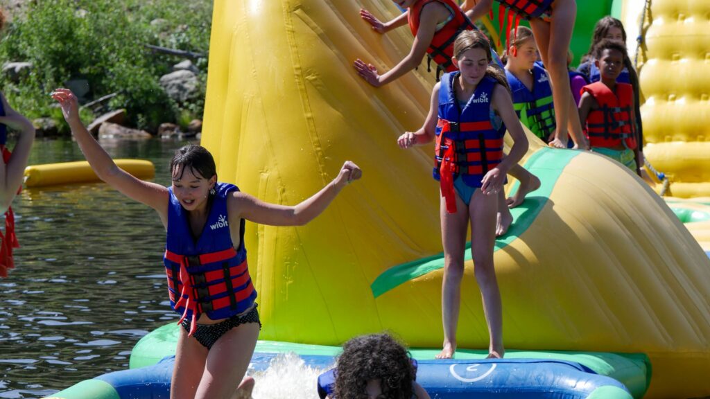 Campers on water obstacle course (Courtesy of YMCA Camp Tumbleson Lake)